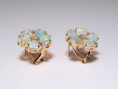 Elegant gold earrings crafted with natural Australian crystal opals